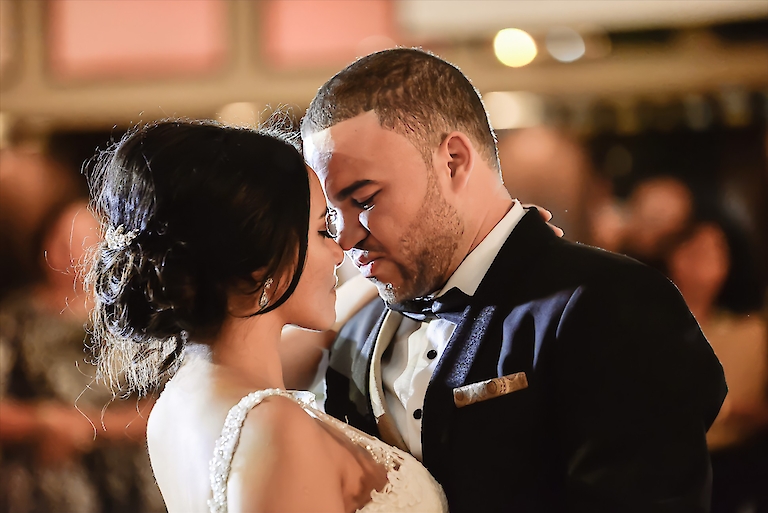 Romantic wedding photo of the couple’s first dance by top-rated wedding photographer Mark David Justo